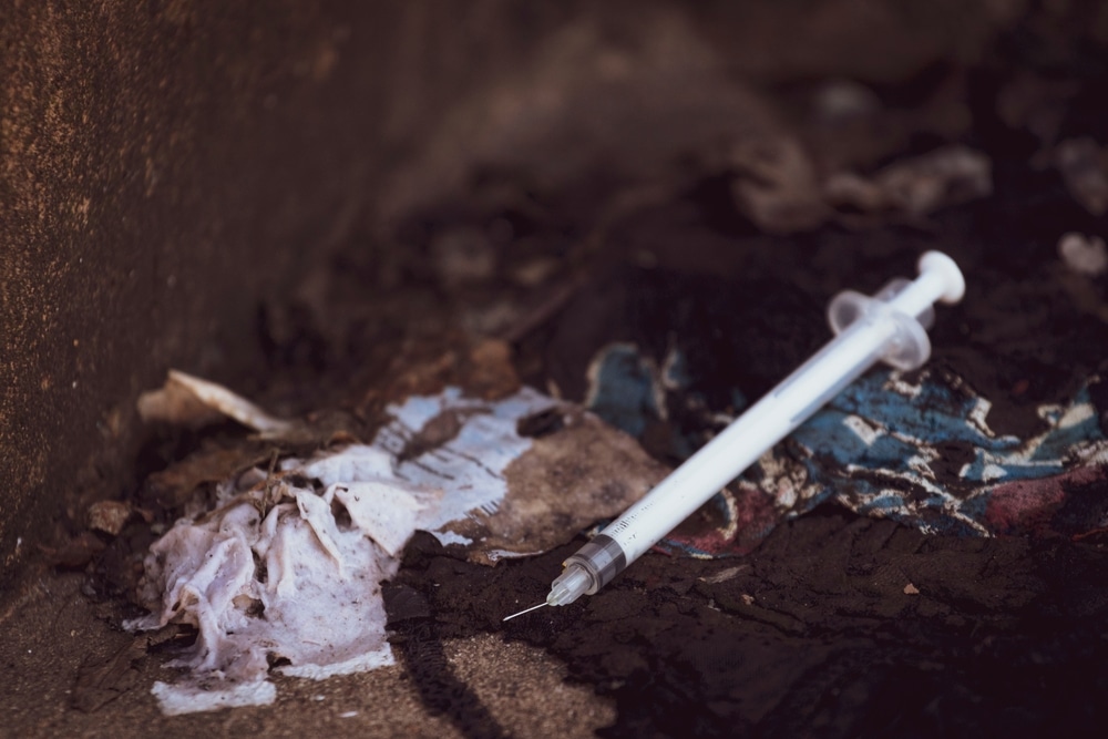 discarded-needle-litter-on-ground-NEPs-harm-reductioin-public-health-opioid-epidemic-sexually-transmitted-diseases-viral hepatitis-save-lives-HIV-infection-drug-treatment