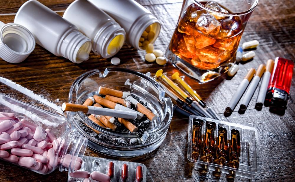 Burnout leading to substance abuse depicting coping mechanisms with addictive substances including alcohol cigarettes and drugs